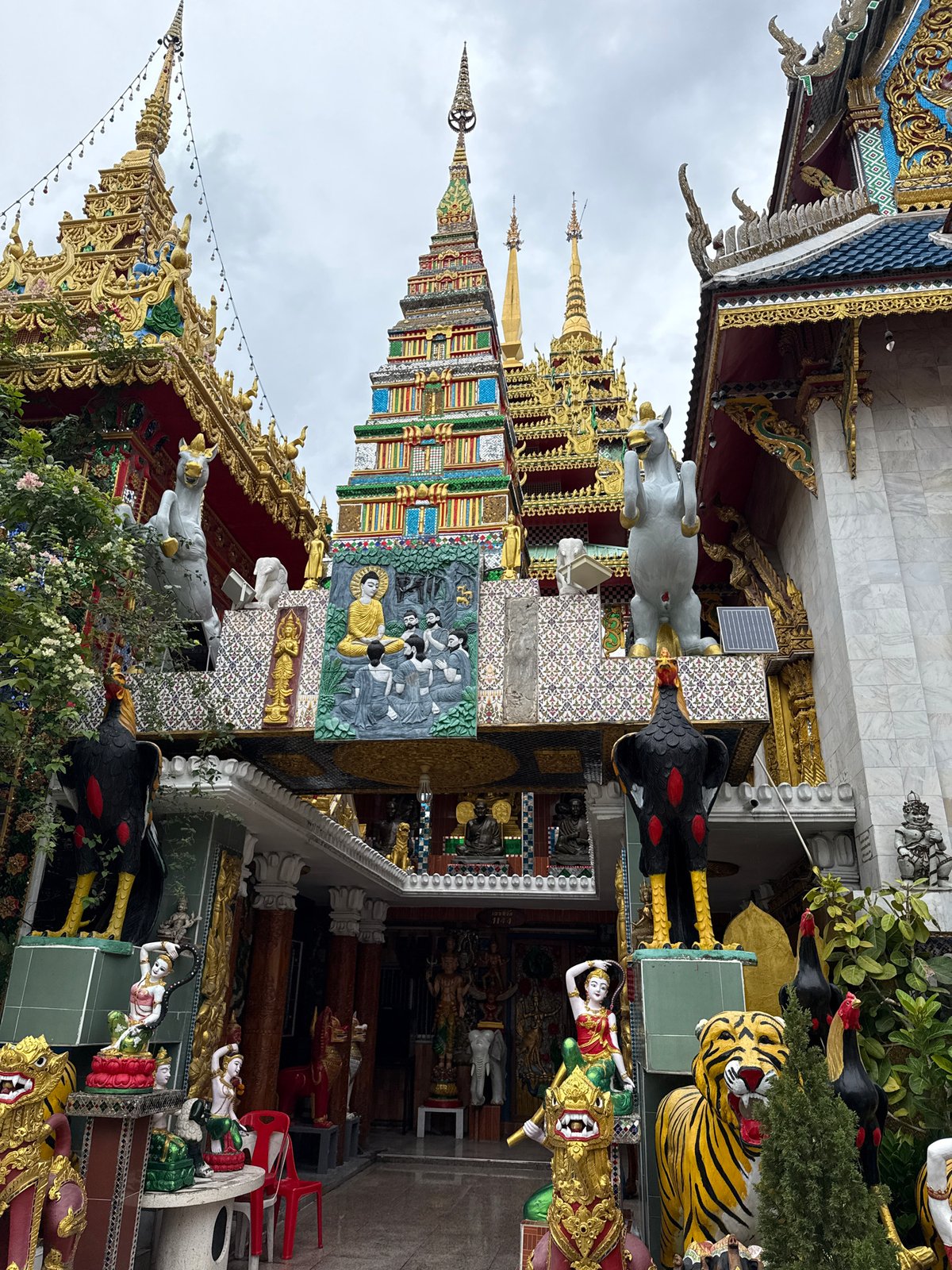 Golden Buddhas and ornate temple spires around Bangkok