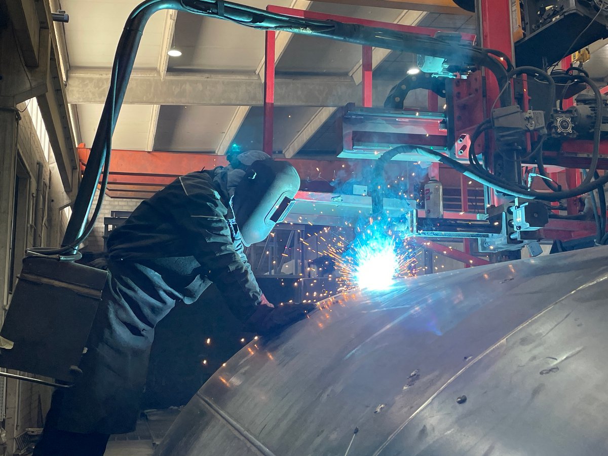 Welder works on metal structure in Montenegro