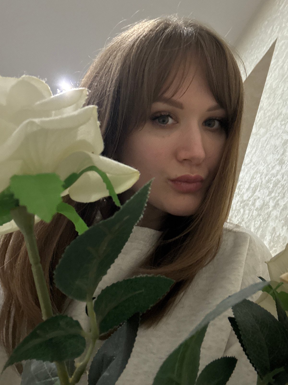Woman photographed near Saratov high-rises during evening hours