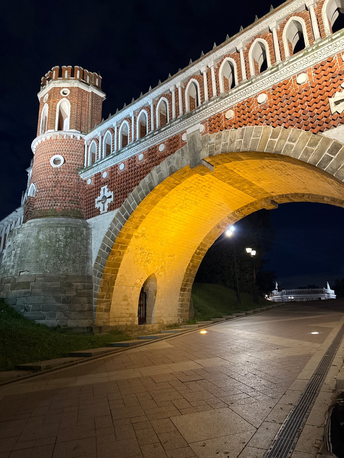 Moscow night: lit arch bridge and a heart on foggy glass
