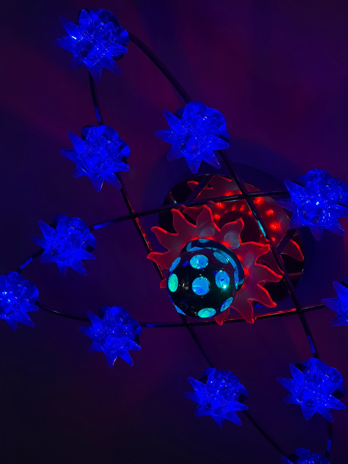 Multi-colored decorative light fixture observed at unknown location