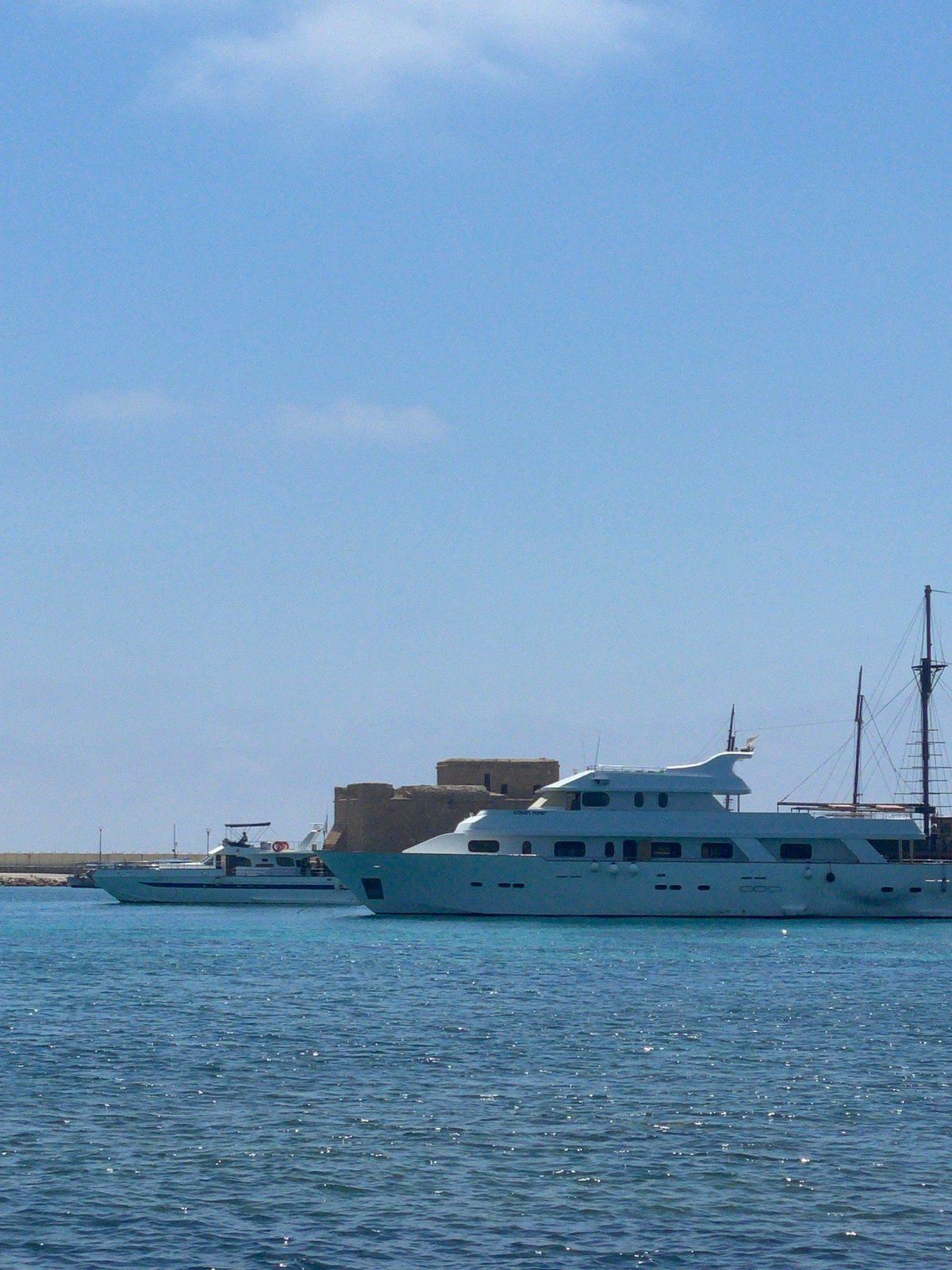 Sunny morning along Paphos harbor and bougainvillea-lined streets