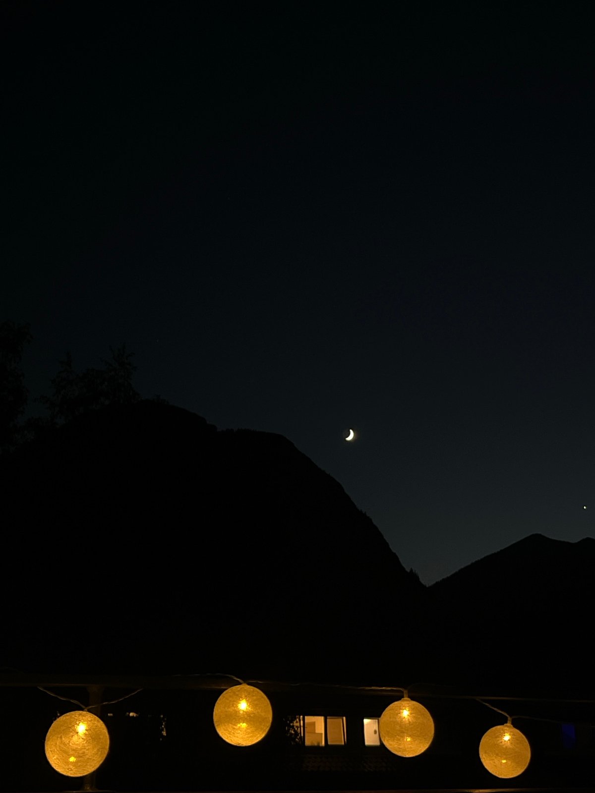 Summer twilight on a Garmisch terrace, Alps fading into night