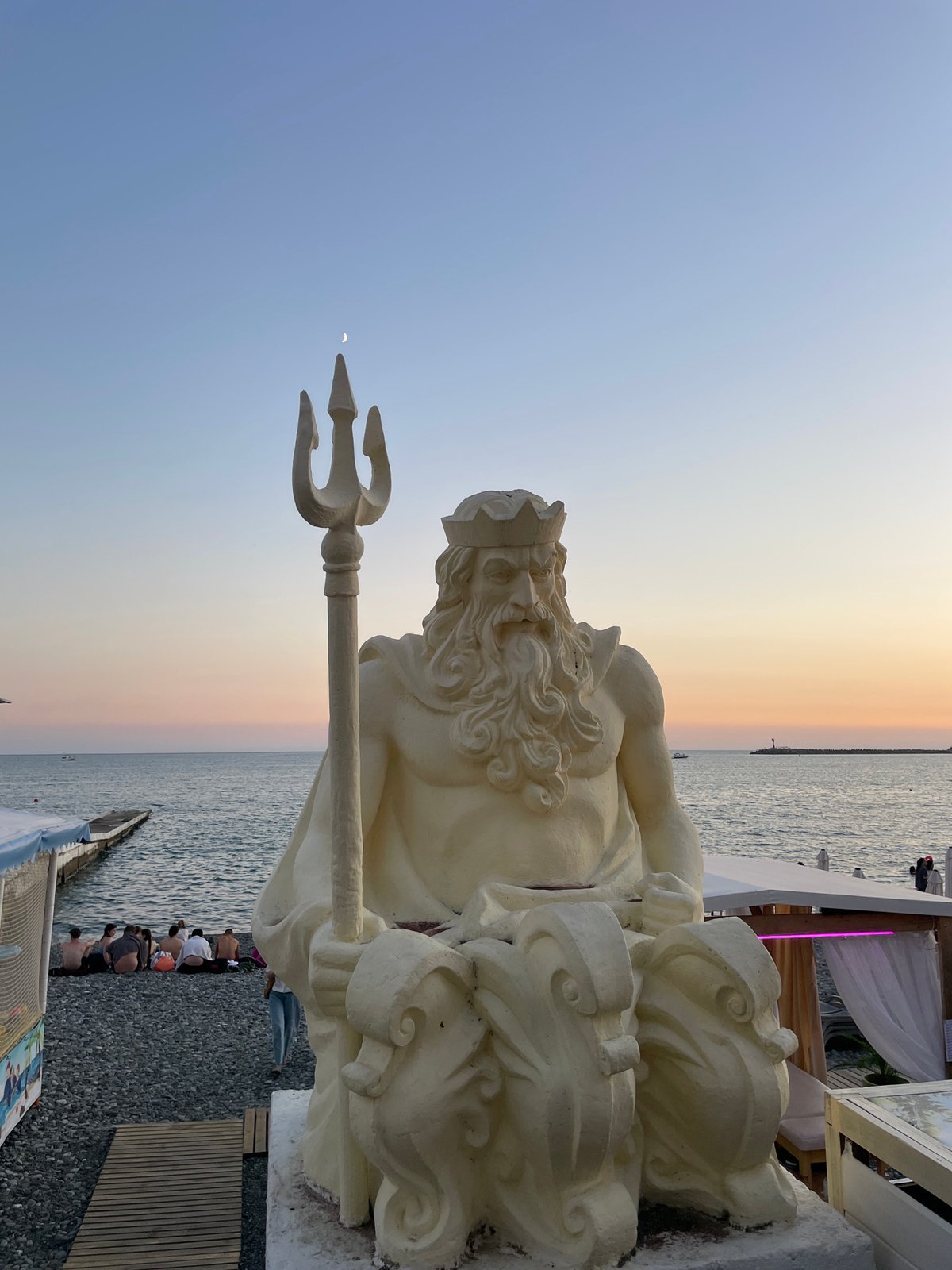 Summer evening on Sochi's waterfront promenade at sunset