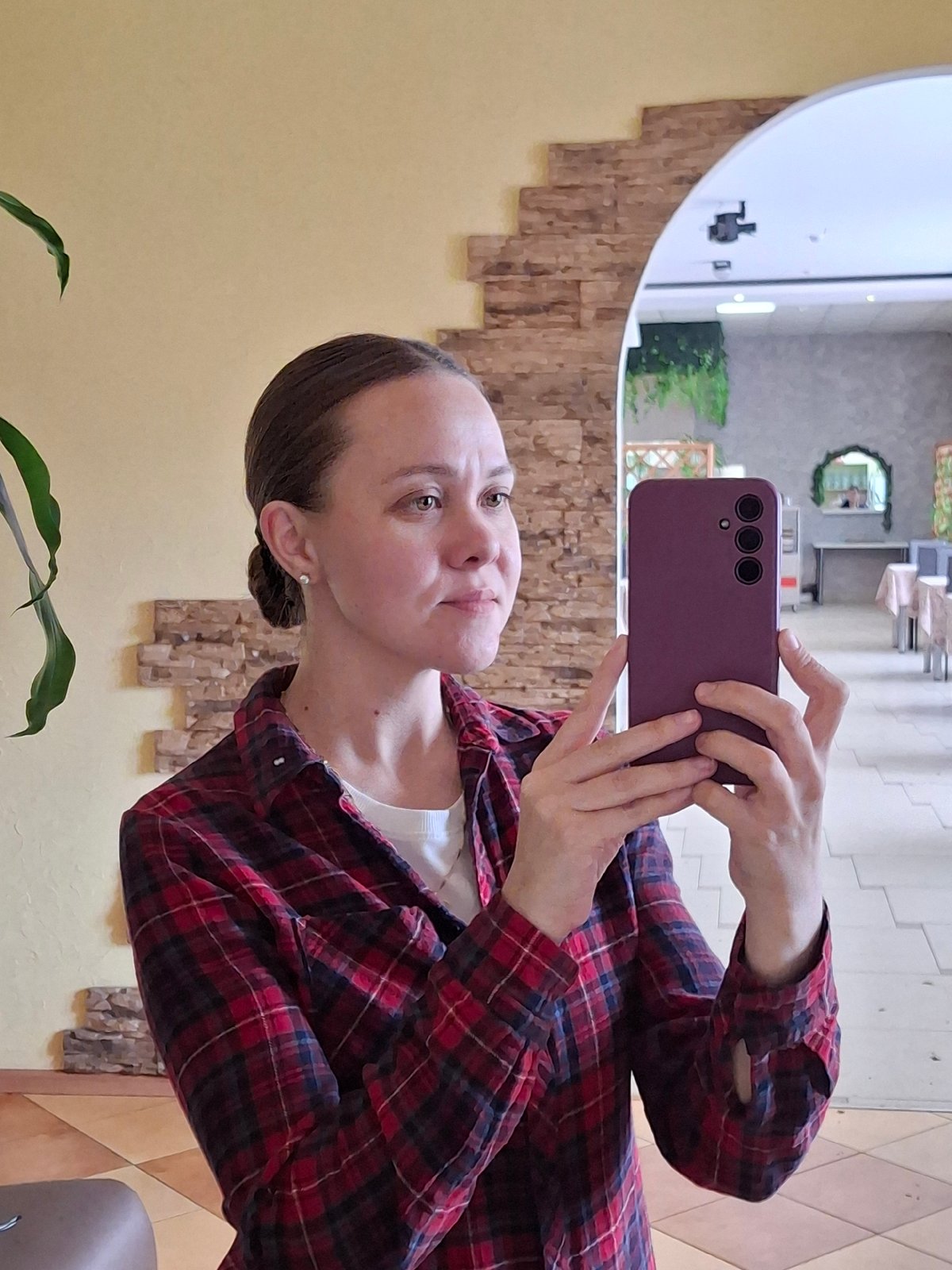 Woman takes selfie with purple phone in Sarapul