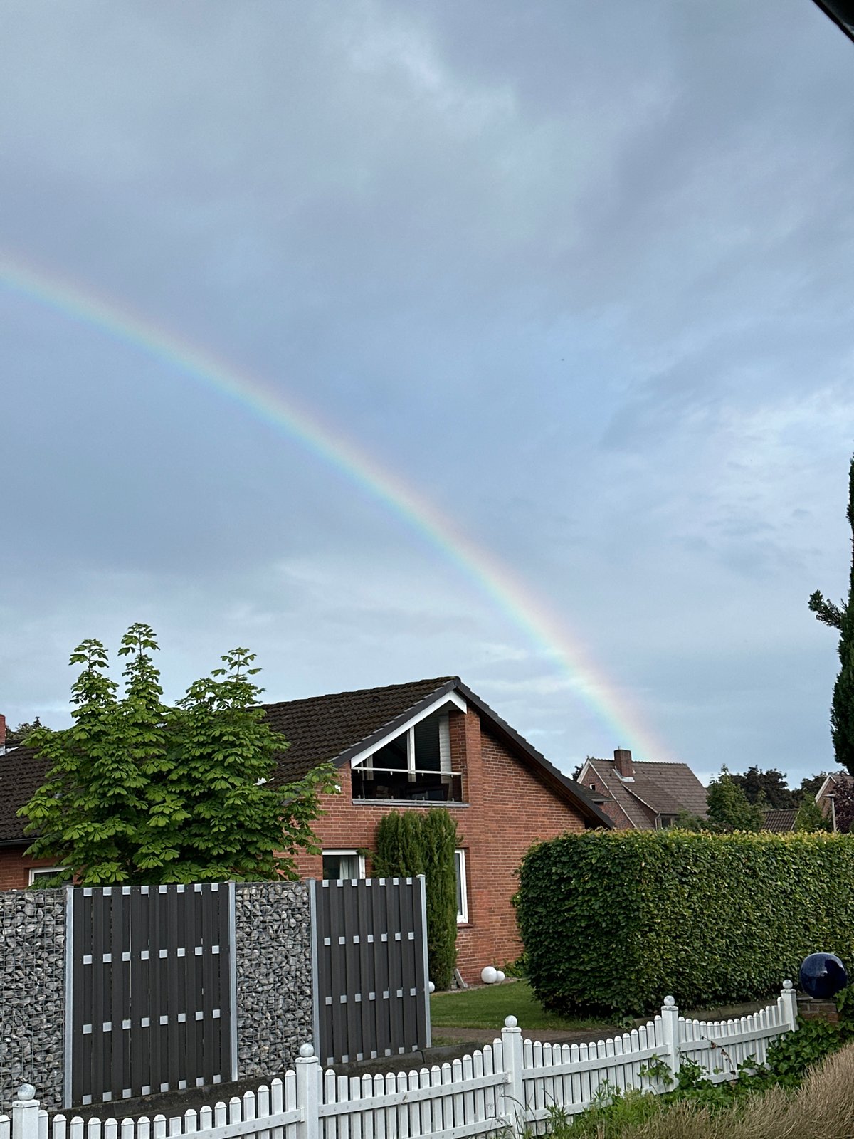 Rainbow appears over Fredenbeck Germany during afternoon storm
