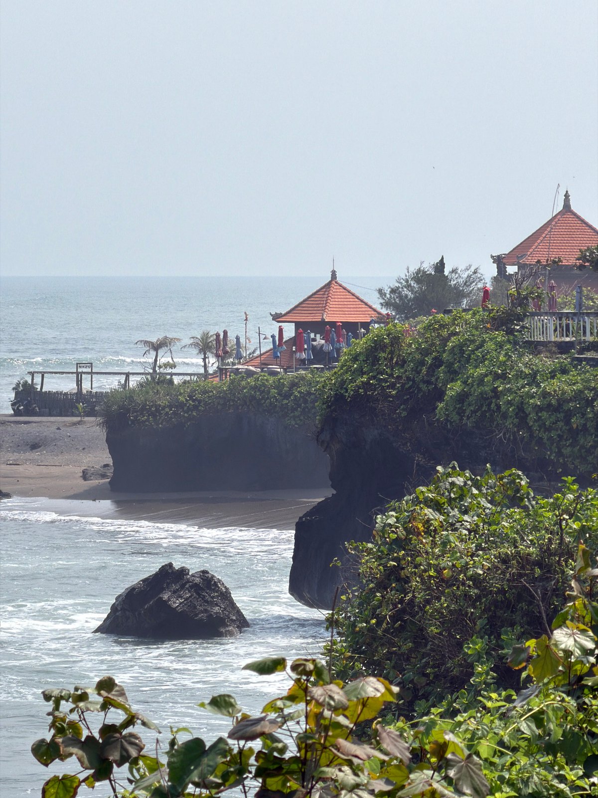 Tanah Lot coastline: sea temple, stone turtles, and volcanic shores