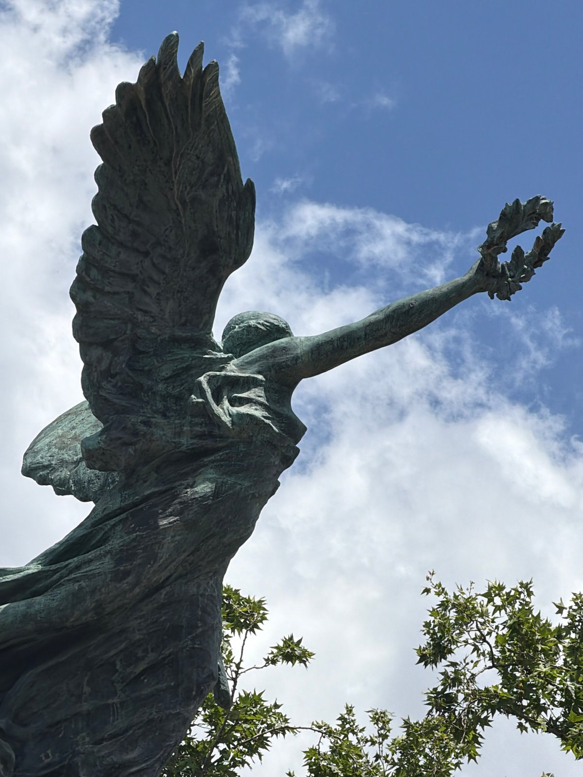 Tourist documents baroque sculptures and bronze statuary in Rome