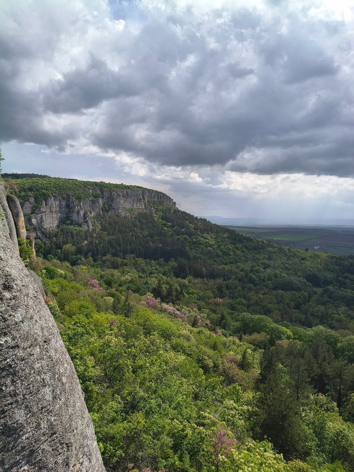 Tourist documents scenic views at Bulgaria's Madara archaeological site