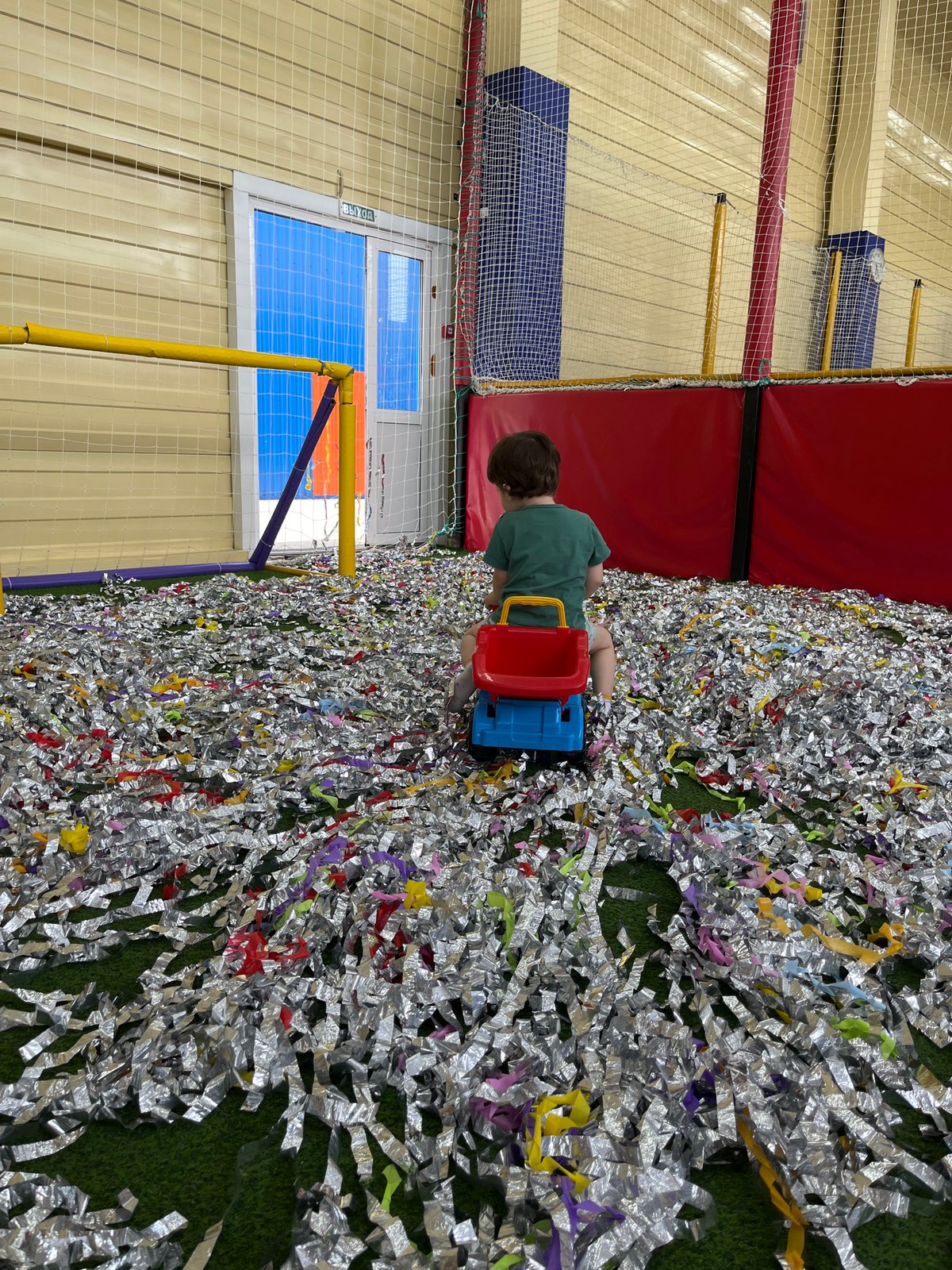 Children play in confetti-filled indoor playground in Chaikovsky, Russia