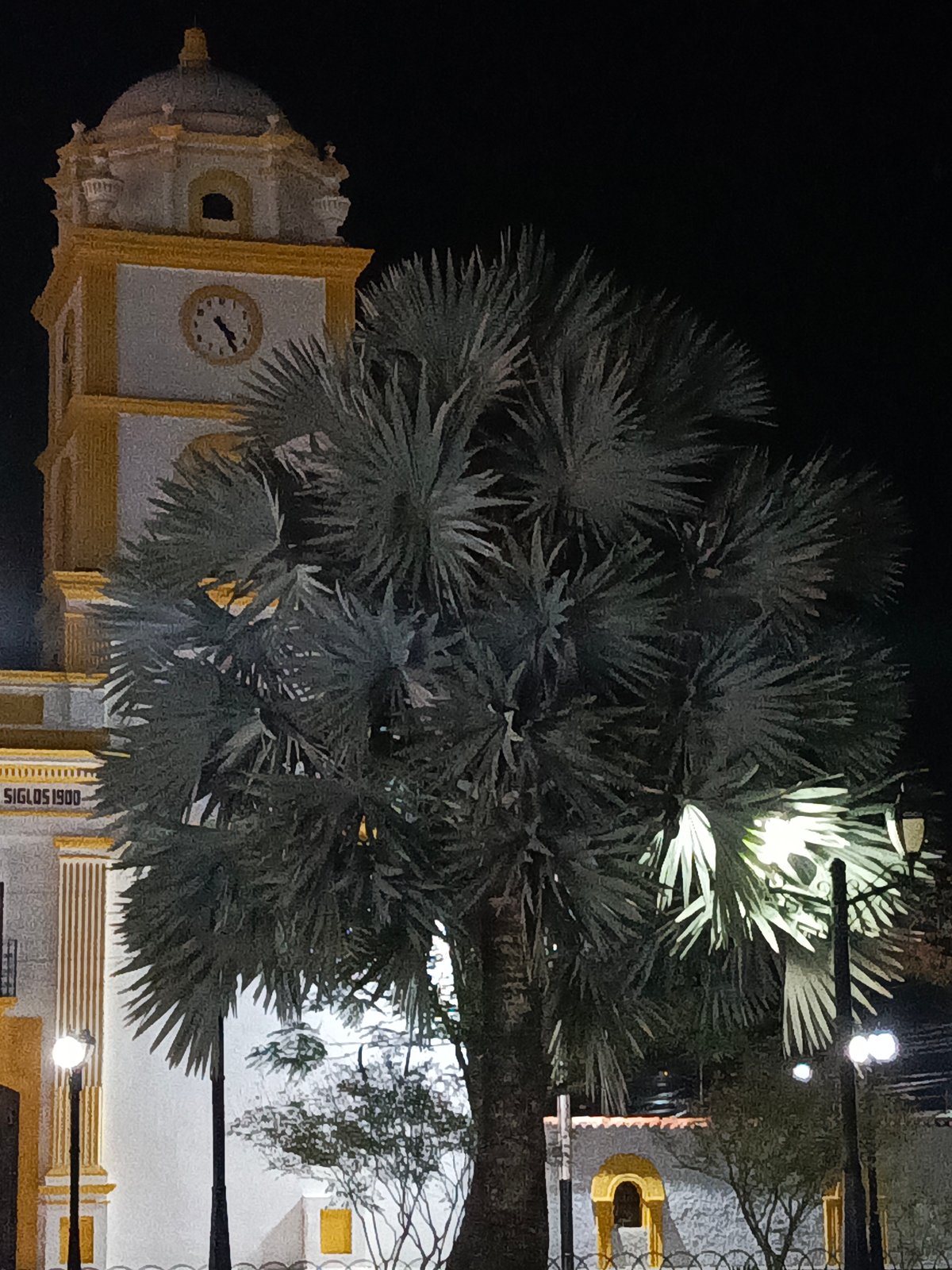 Tinaco's nighttime church tower and street lamps documented