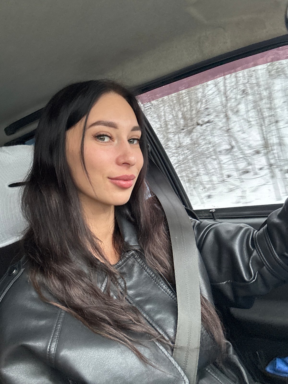 Women travel through snowy Chaikovsky in winter vehicle journey