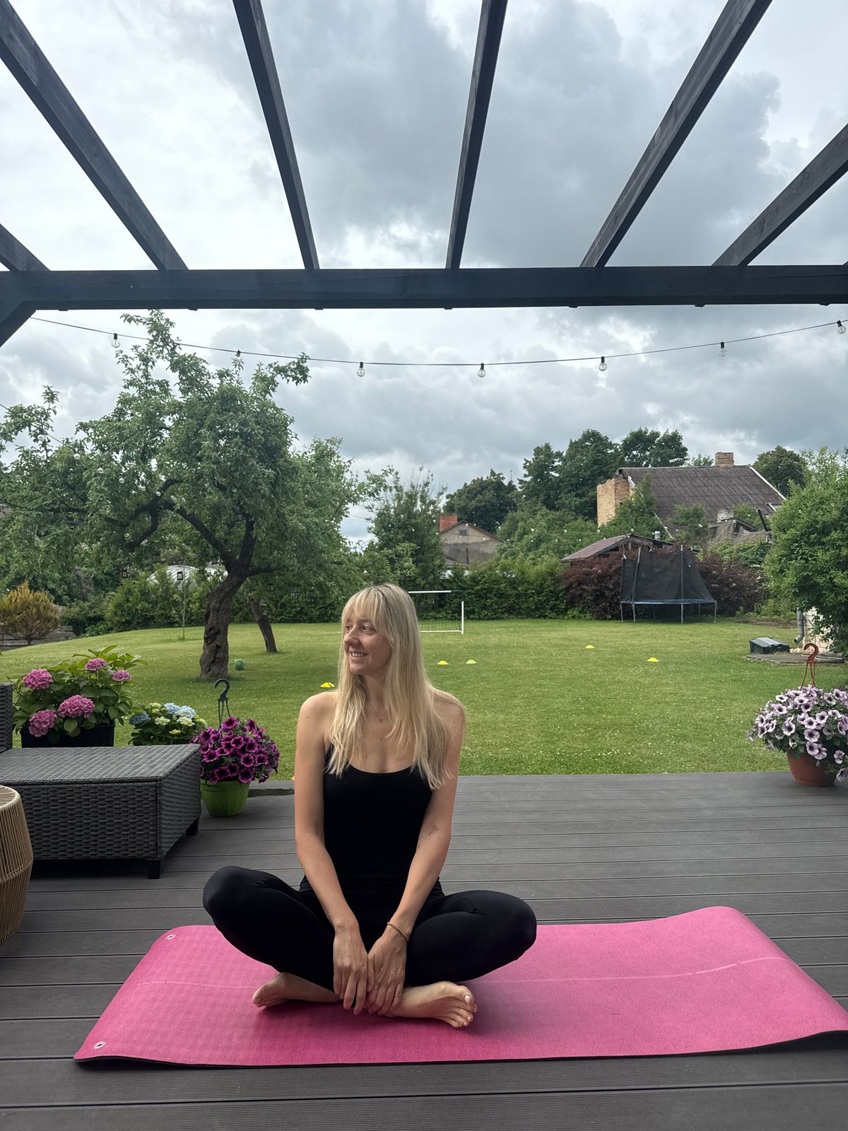 Morning yoga session captured on wooden deck in Carnikava