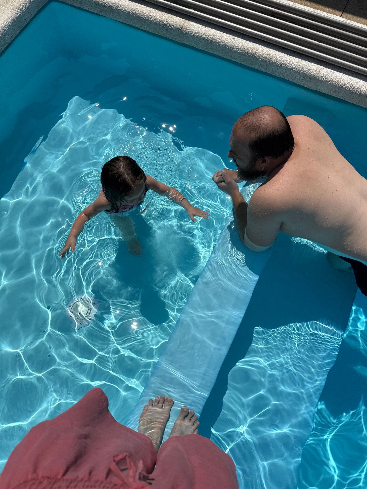 Poolside morning with kids, lounging, and garden surroundings