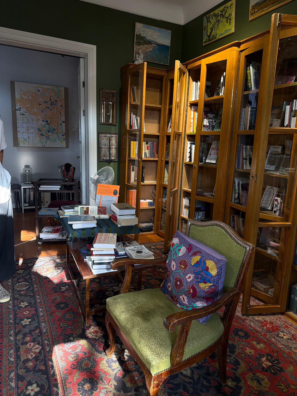 Urban architecture, fountains, and a cozy book-filled interior