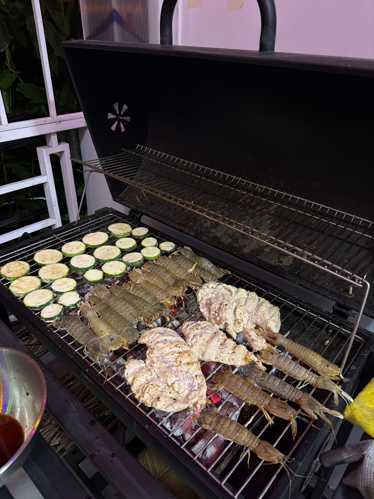Outdoor barbecue session with seafood and vegetables in Nha Trang