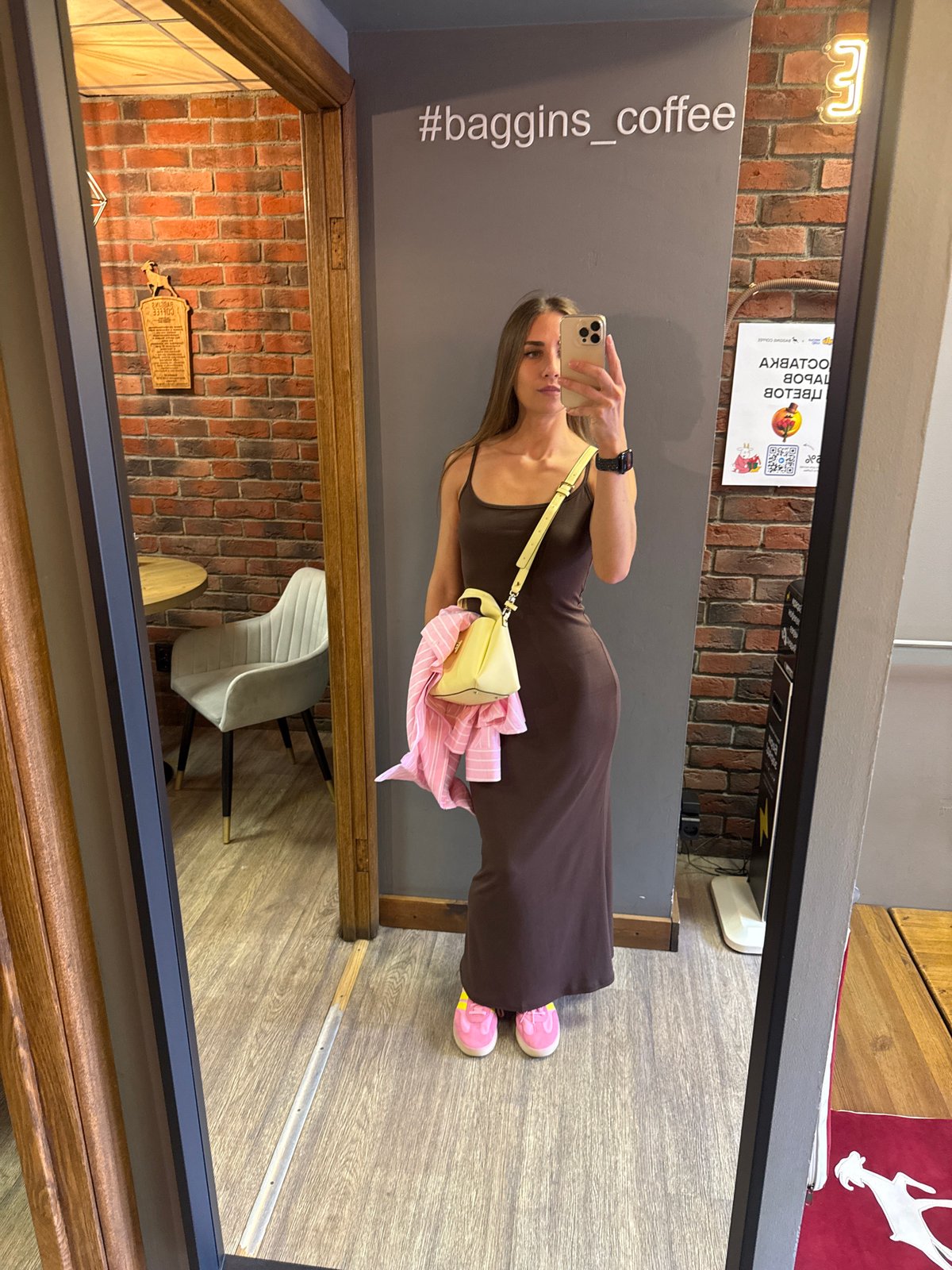 Woman takes mirror selfies at Saint Petersburg cafe