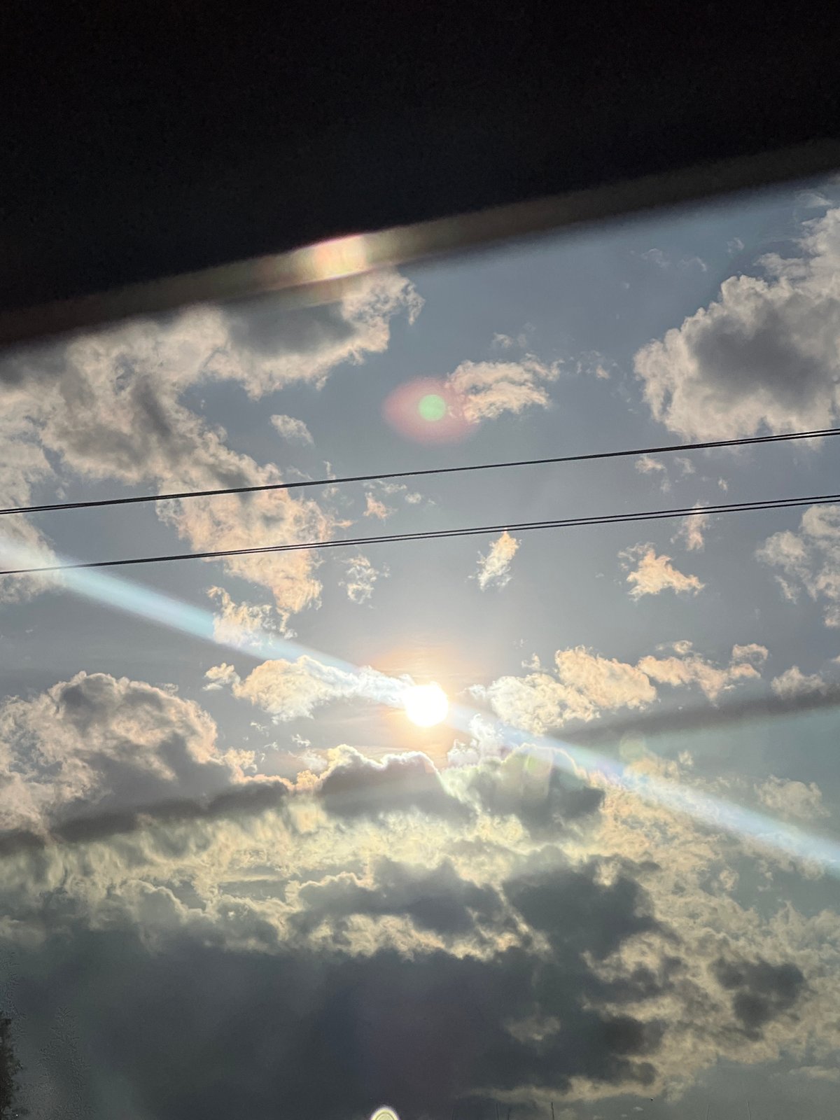 Bright afternoon sun creates dramatic lens flares over Pesnopoy