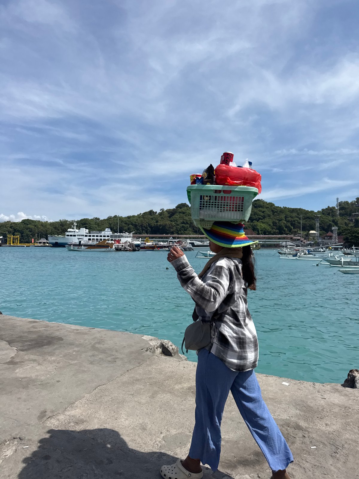 Morning ferry and tourist activity documented in Manggis harbor