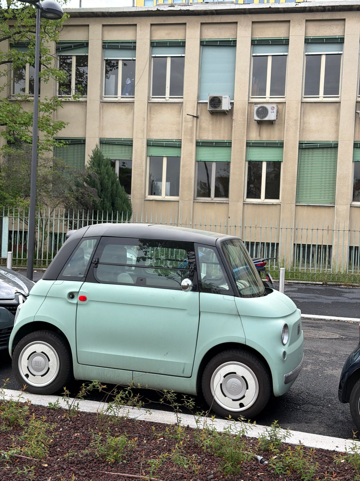Electric Fiat 500e spotted parked on Milan sidewalk