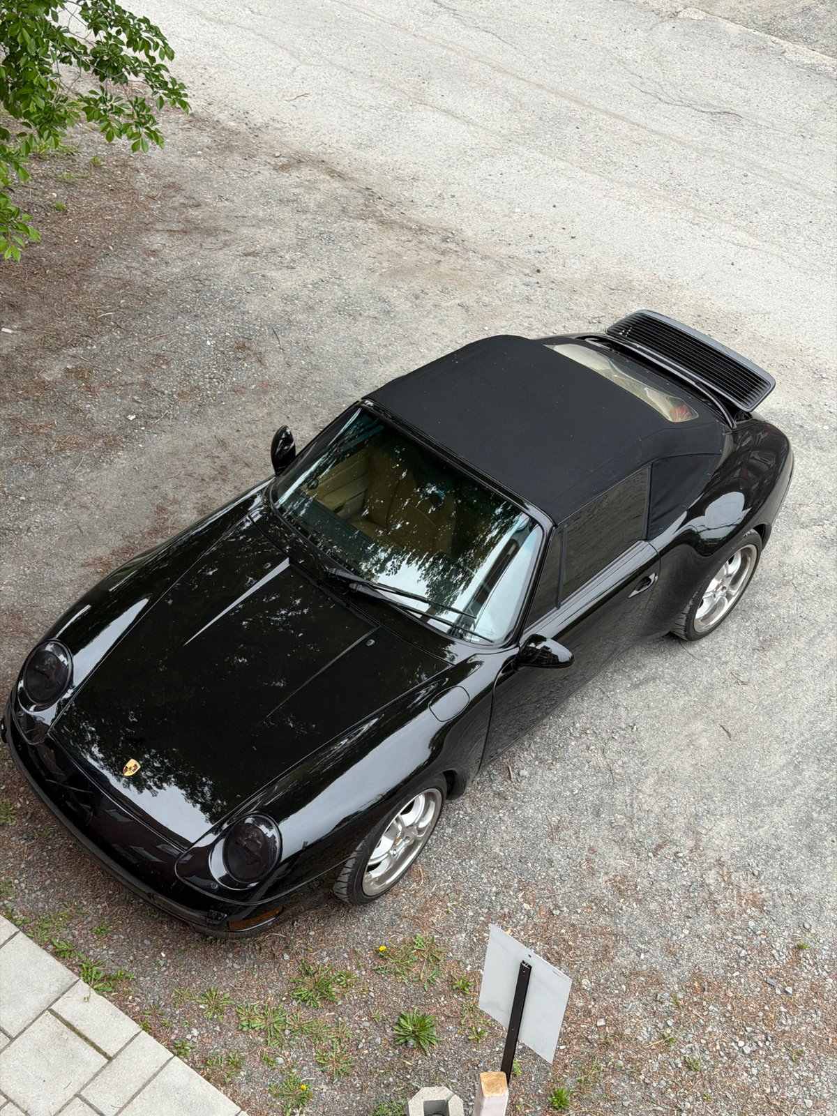 Black Porsche convertible spotted parked in Montreal evening