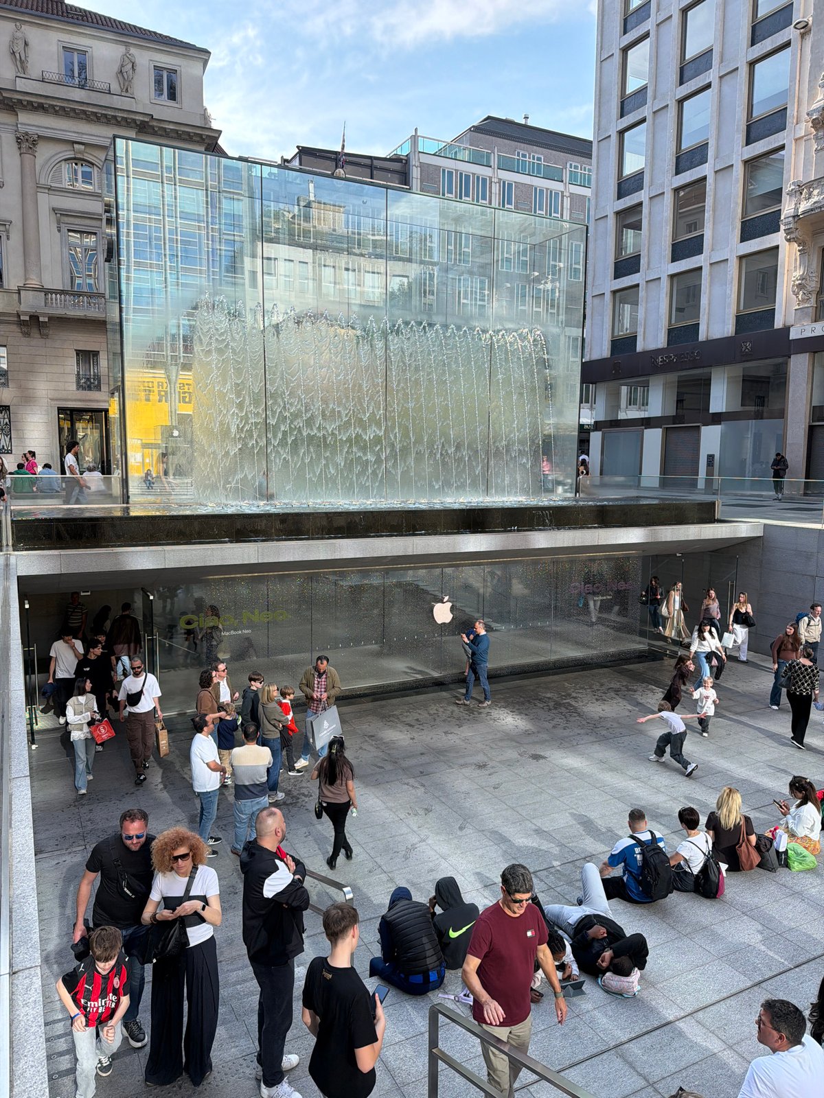 Crowd waits outside Milan Apple Store for product release