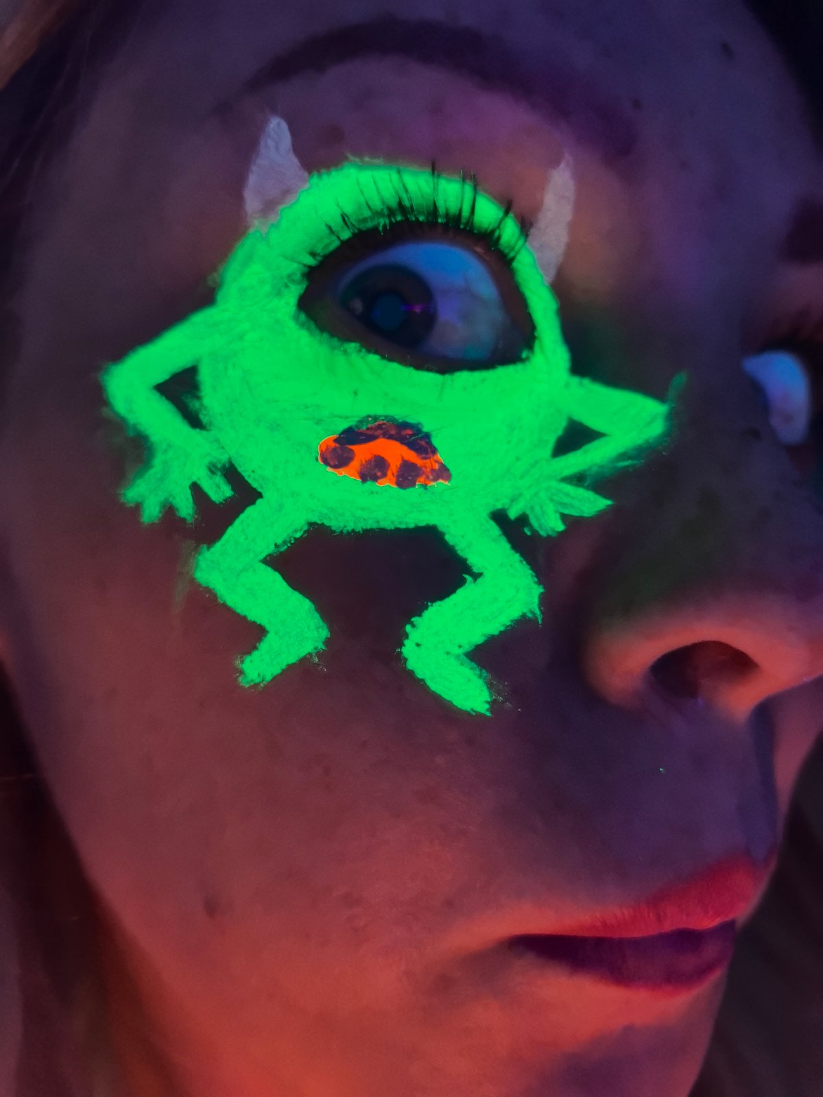 Person experiments with UV makeup in Noviy, Russia