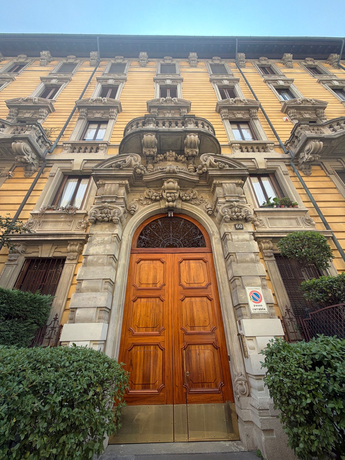 Ornate yellow building on Via Visconti, Milan