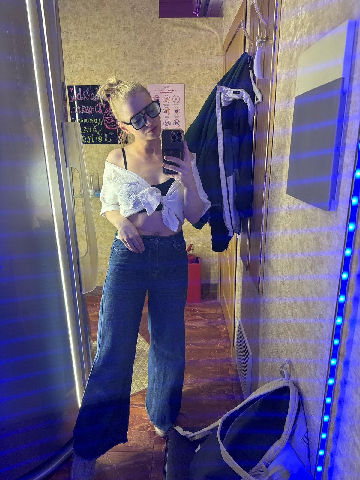Woman takes mirror selfies indoors in Saint Petersburg