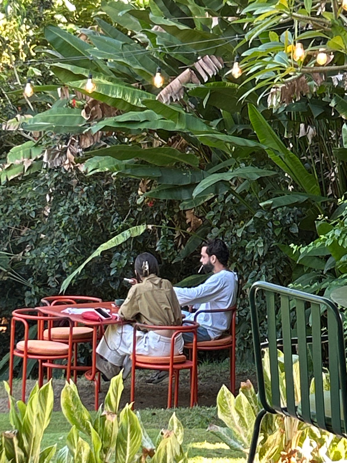 Busy café-resort day in Mengwi, Bali — art, coffee, and full tables