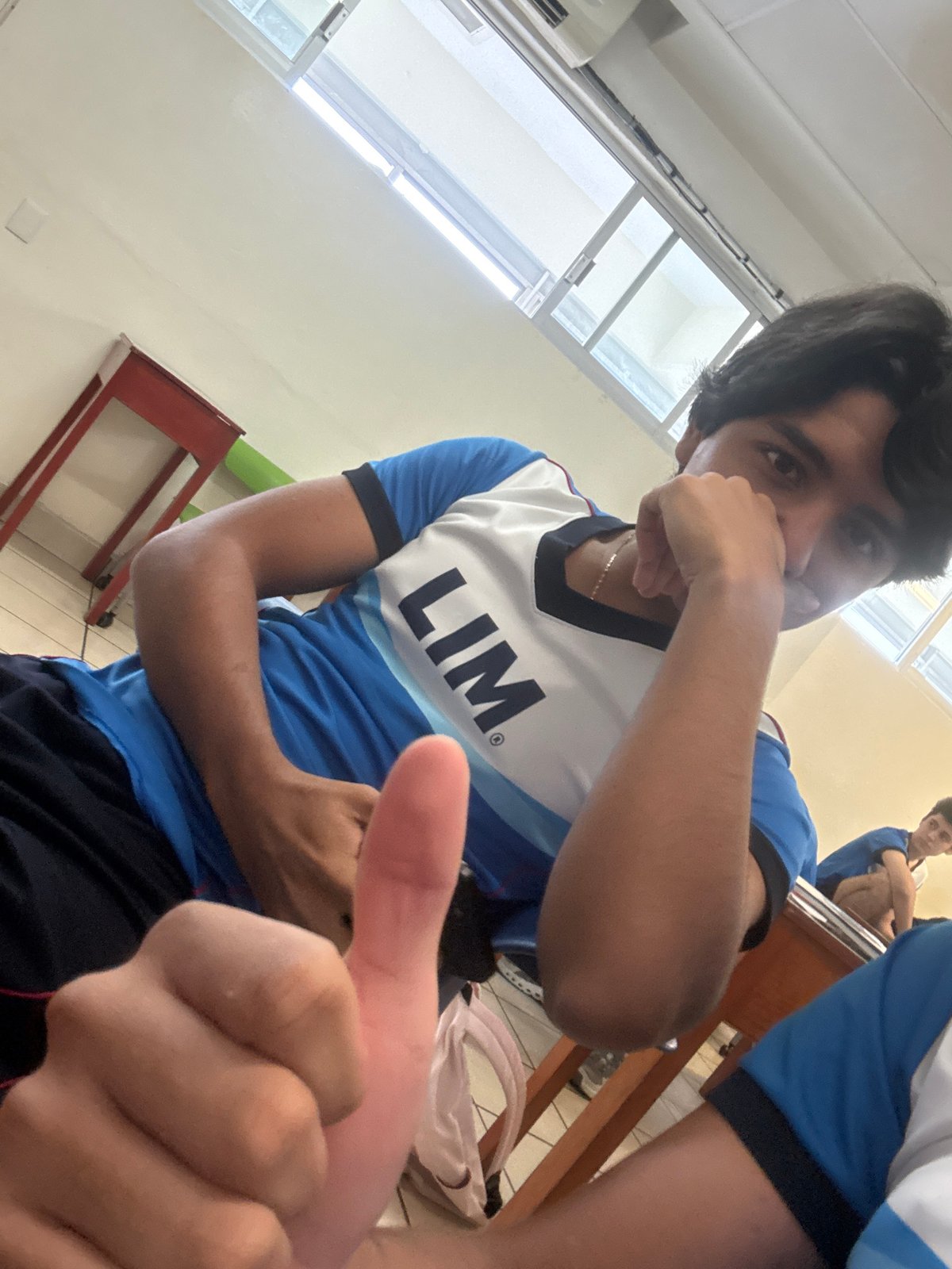 Young man photographed in Acapulco classroom setting