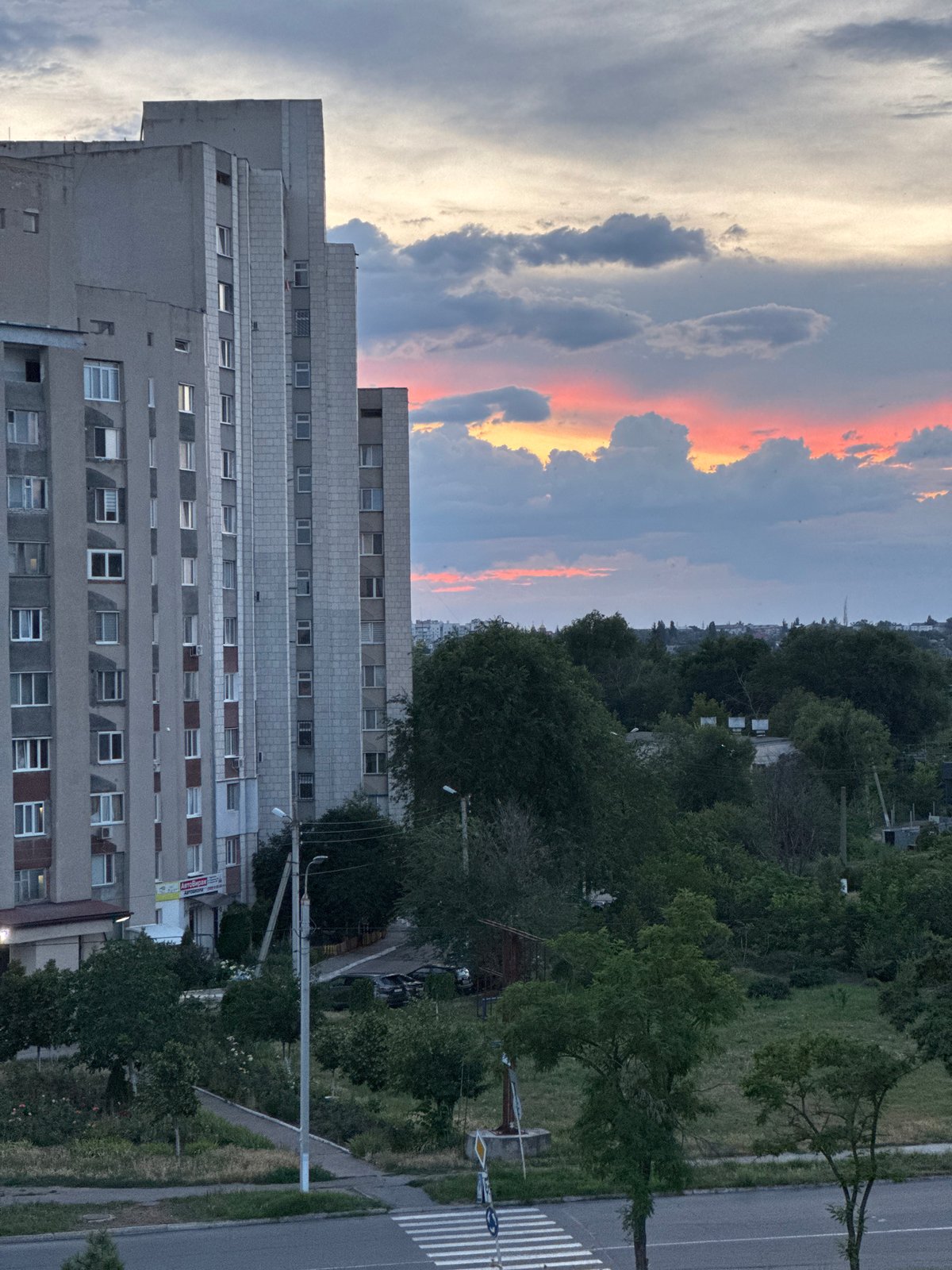 Sunset over Tiraspol's Soviet-era skyline, seen from a balcony