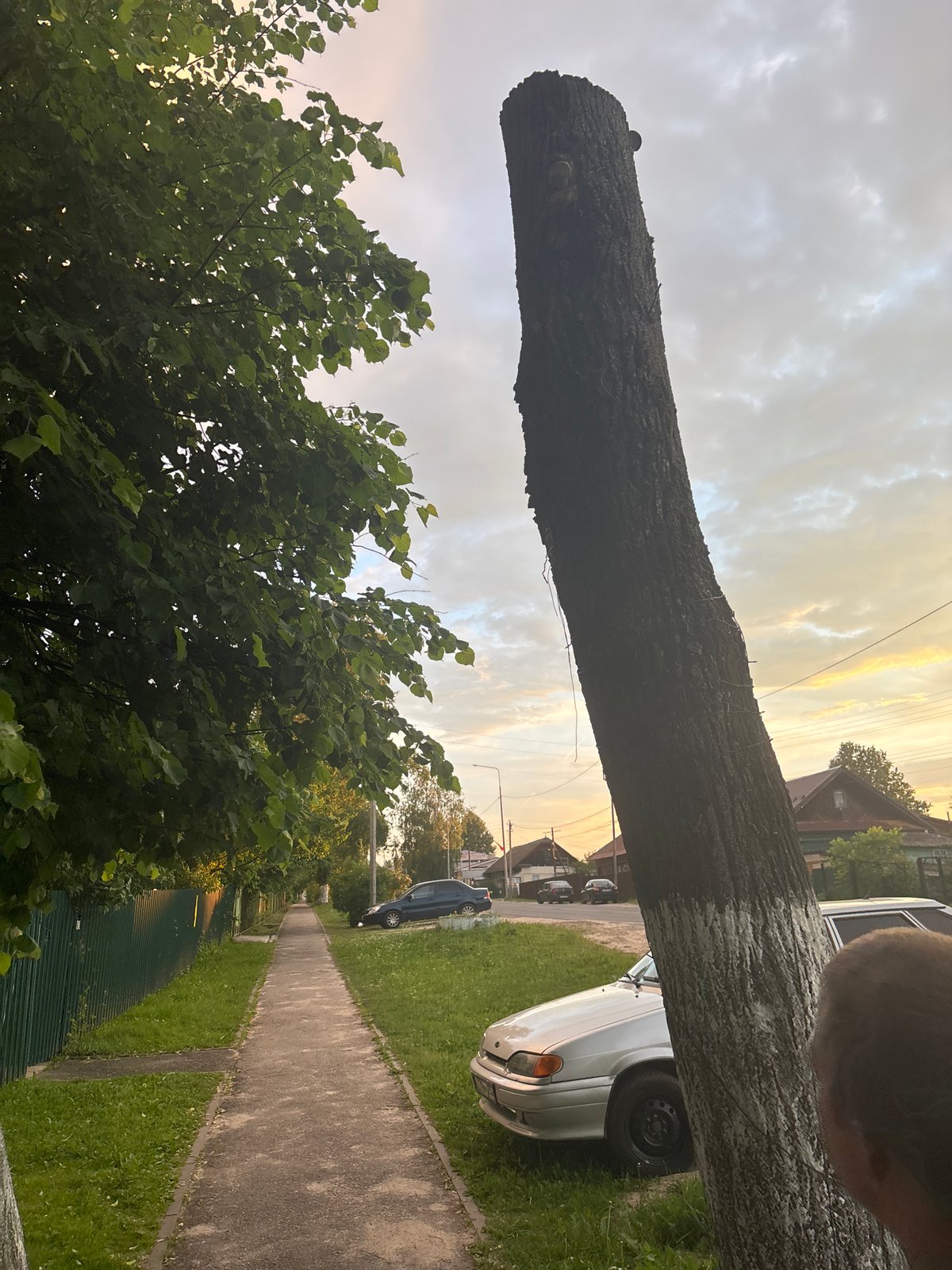 Evening walk documented through Russian village during dramatic sunset