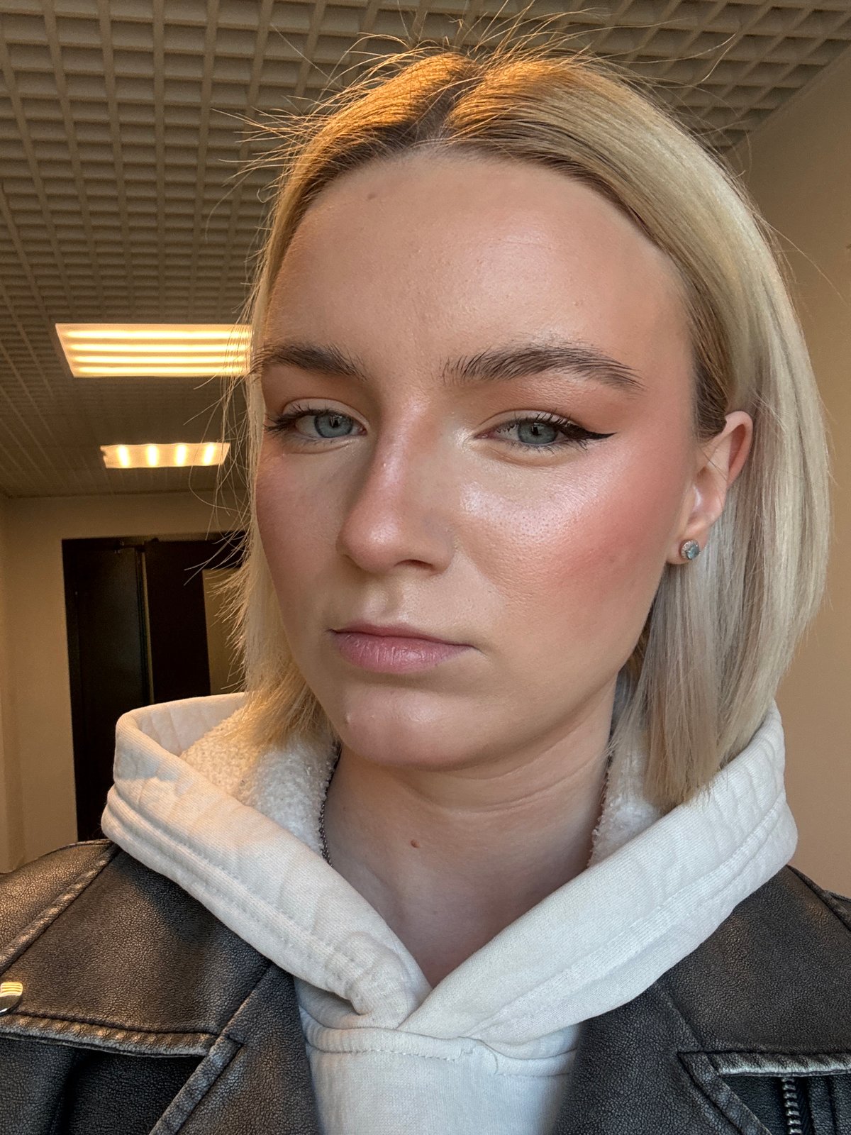 Blonde woman photographed near Russian apartment buildings early morning