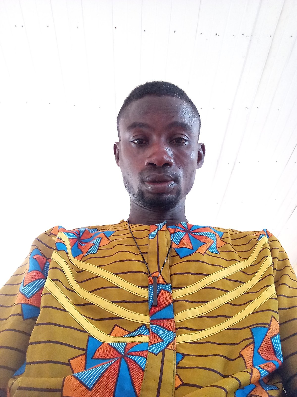 Man in patterned olive shirt observed in Zango-ndaji, Nigeria