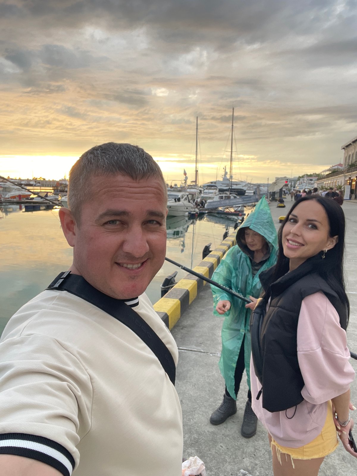 Tourists enjoy typical afternoon activities at Sochi marina district