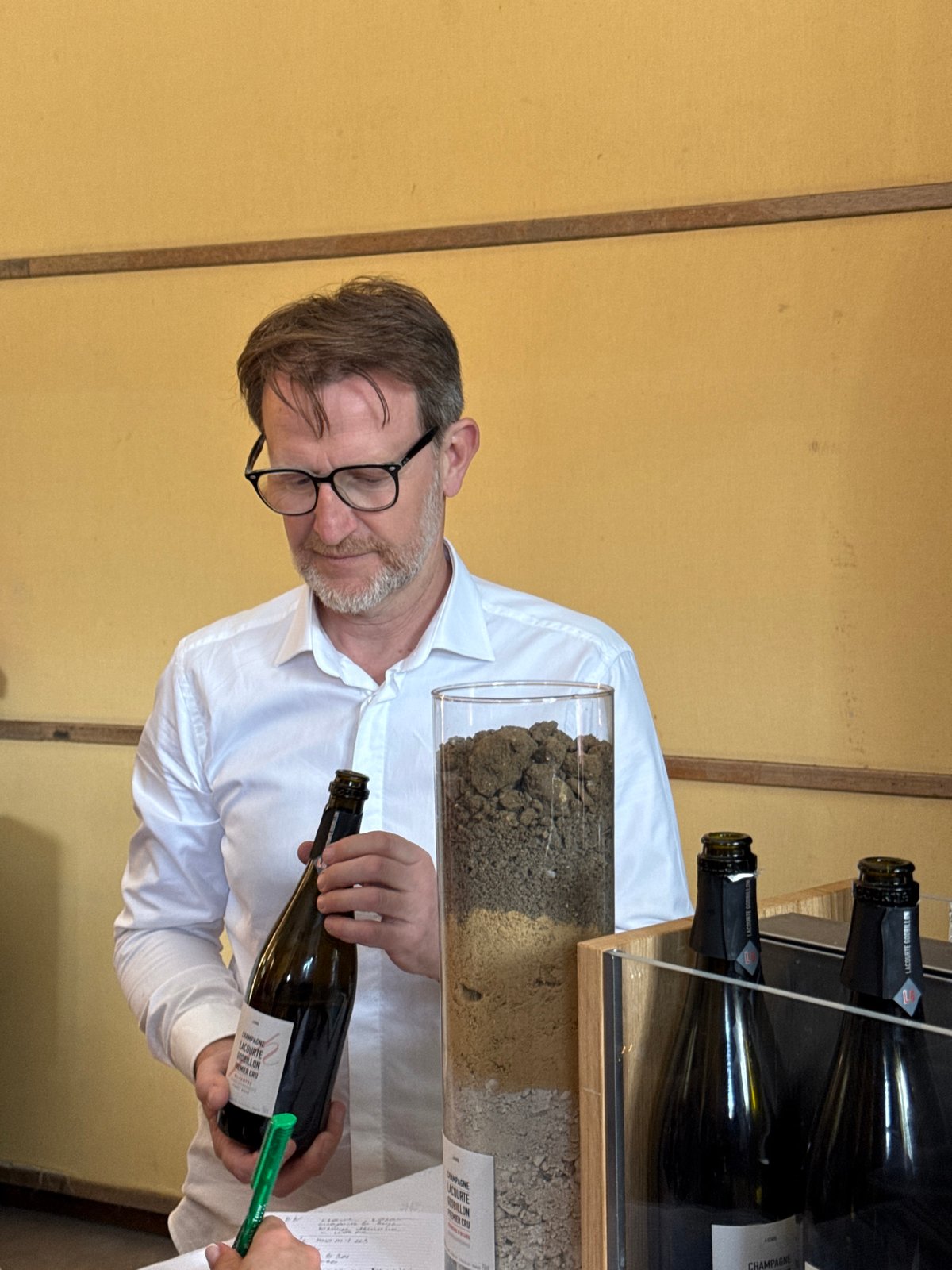 Man conducts champagne tasting presentation in Reims, France