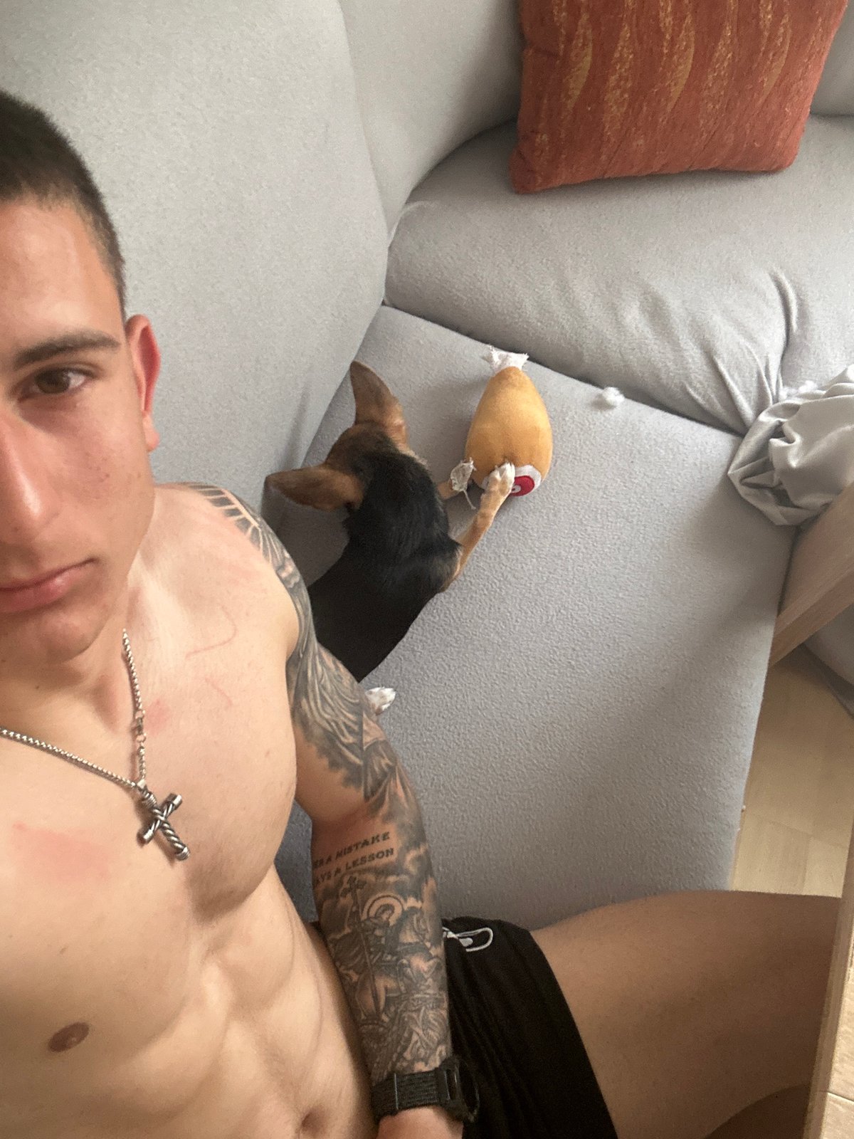 Man and dog relax on couch in Burgas