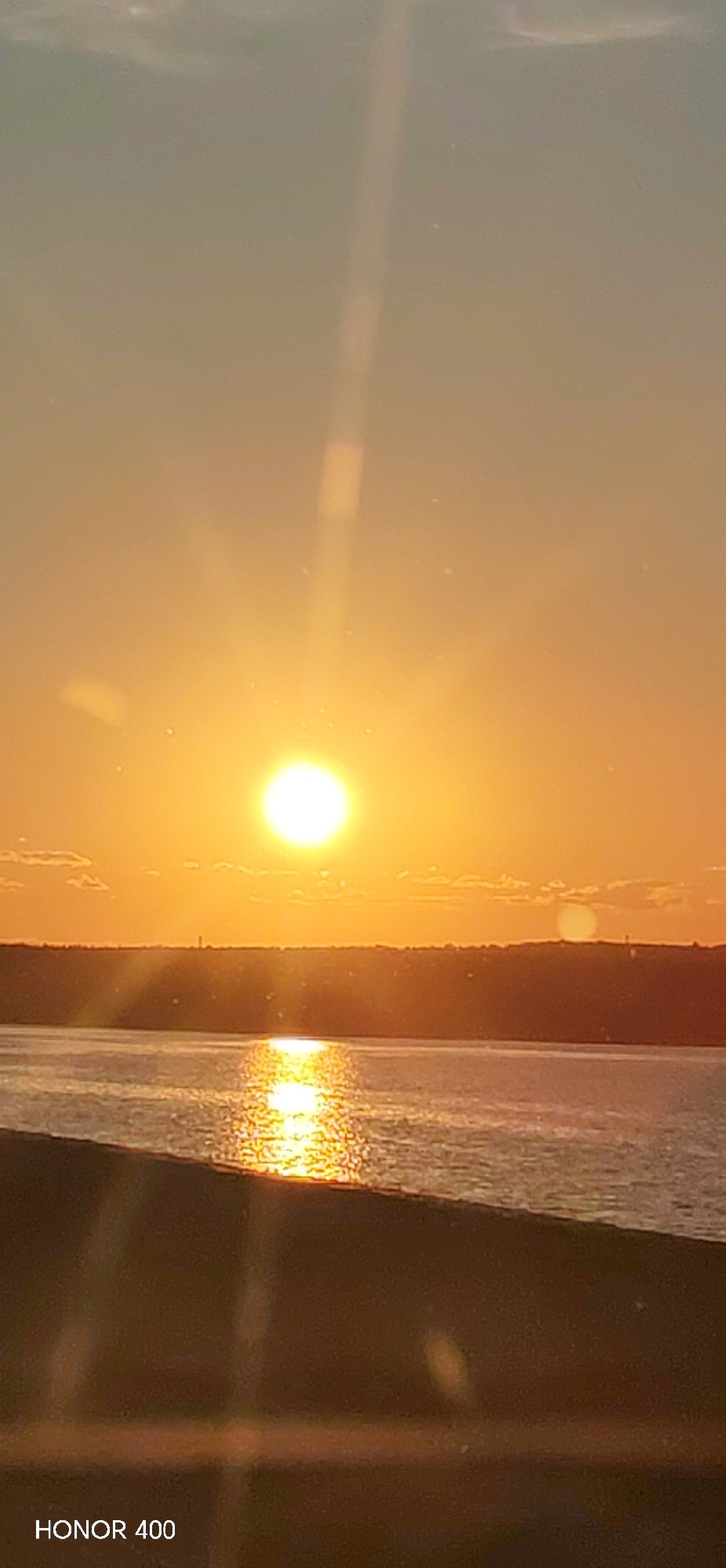 Sunset documented over water in Chaikovsky, Russia