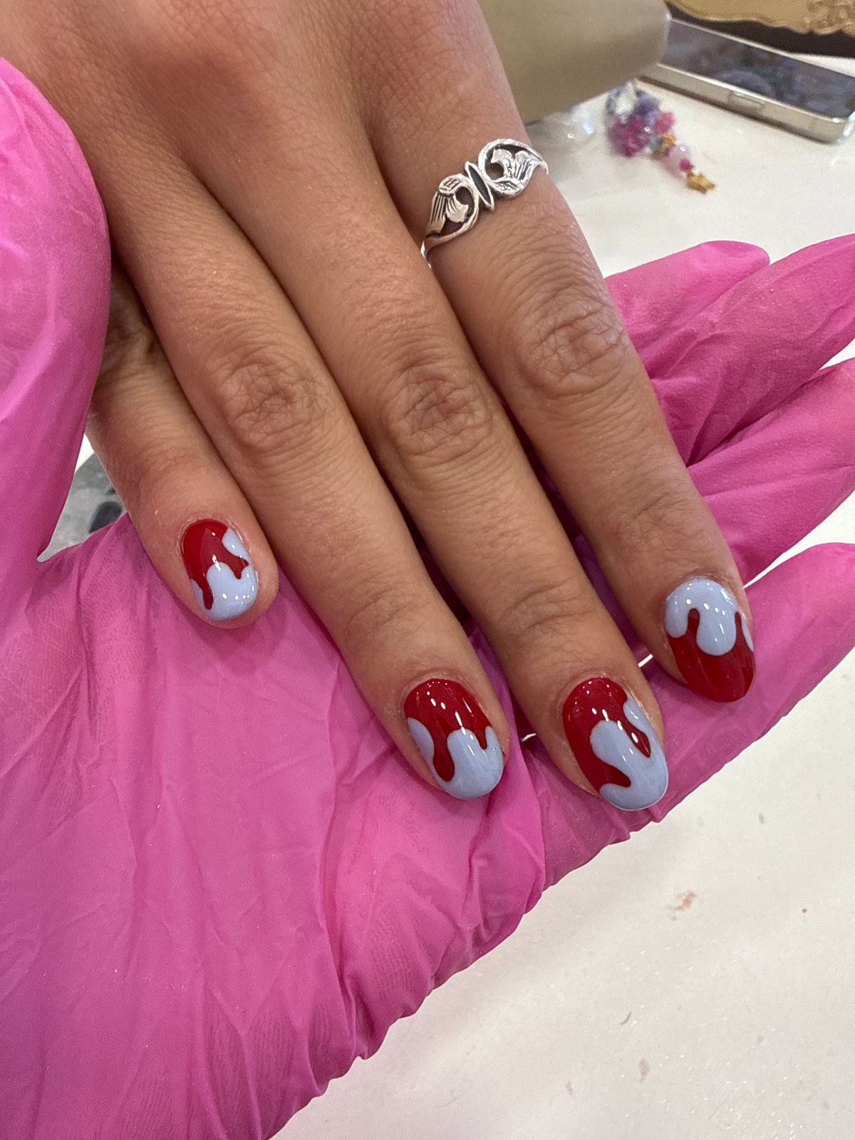 Fresh manicure with red-purple nail art completed in Sofia salon