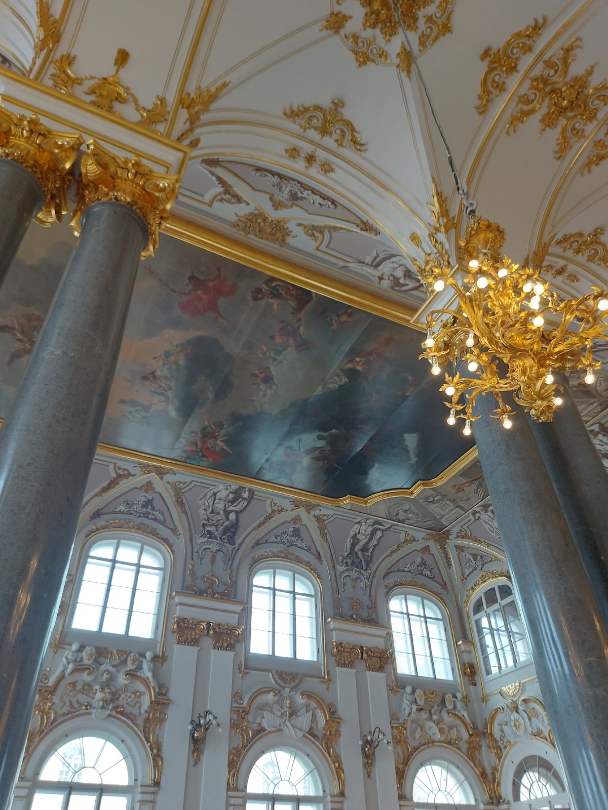 Visitor documents Winter Palace museum exhibits in Saint Petersburg
