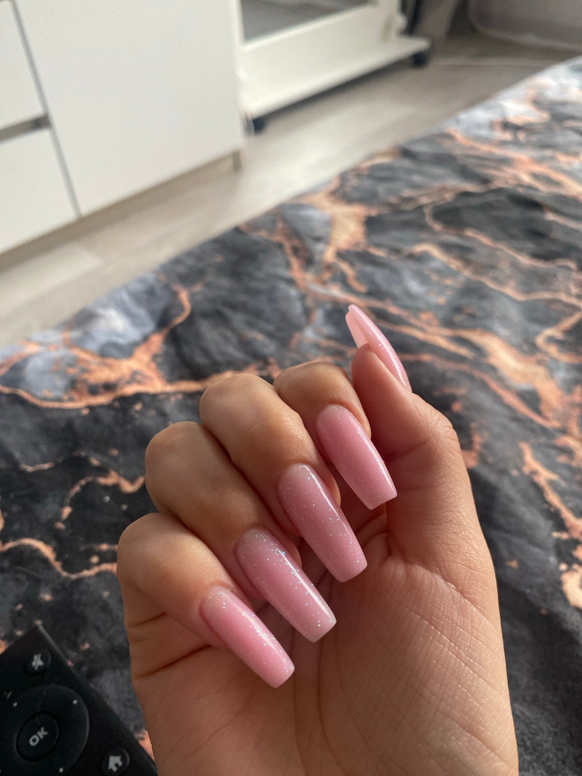 Woman documents nail art in early morning selfie session