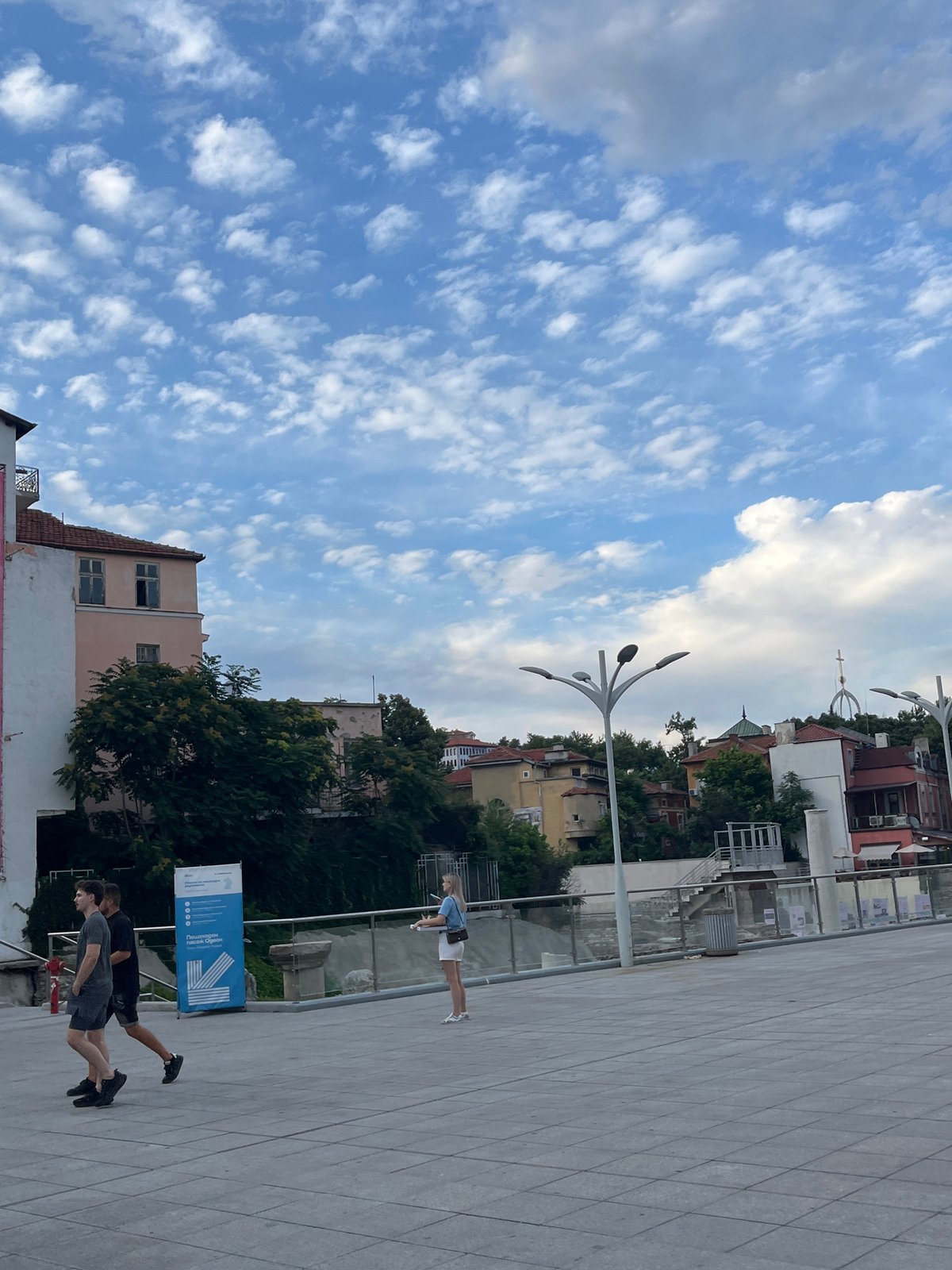 Afternoon in Plovdiv's pedestrian zone, neon green bike in frame