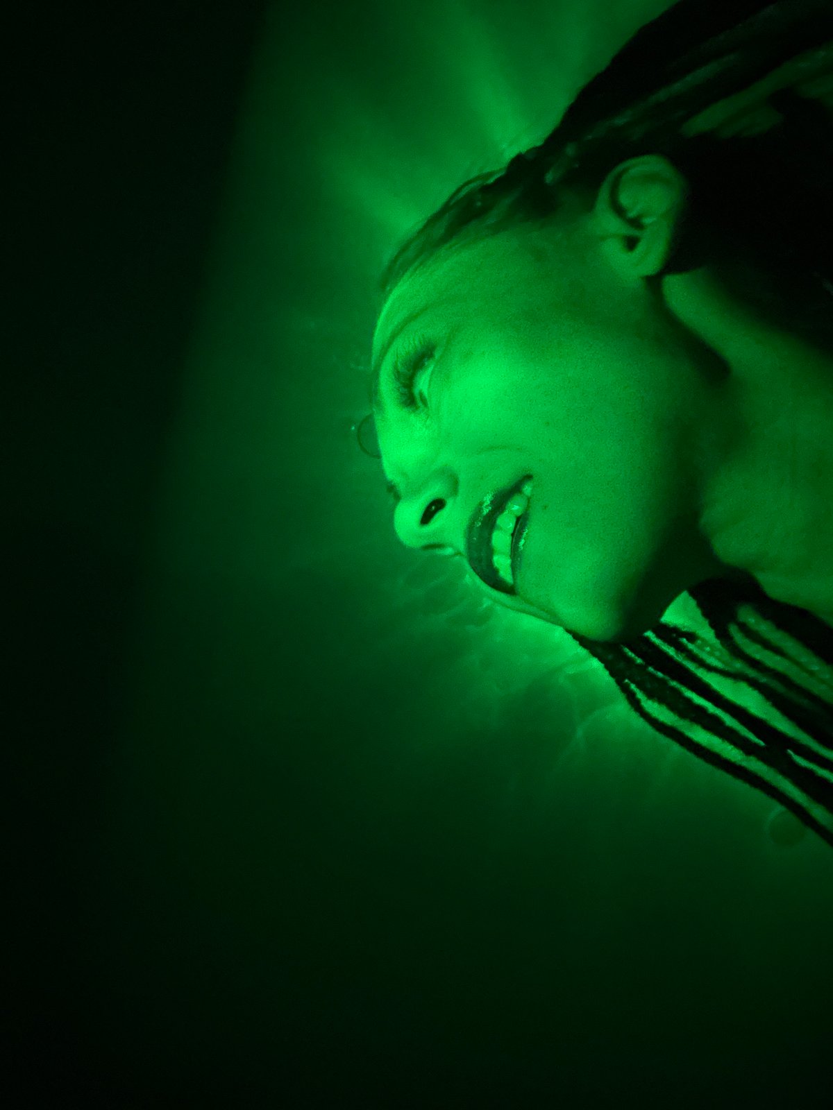 Underwater portrait captured in green light near Rusanovo