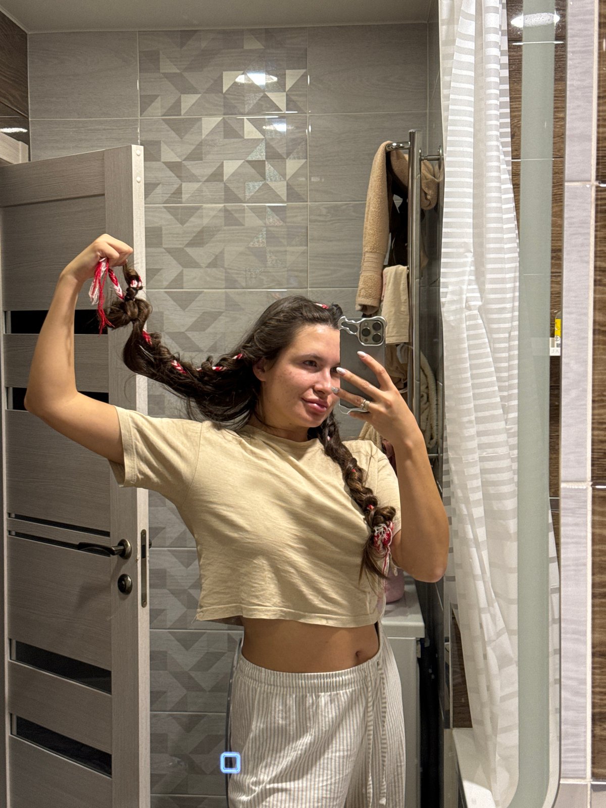 Woman documents evening routine through bathroom selfies and relaxation
