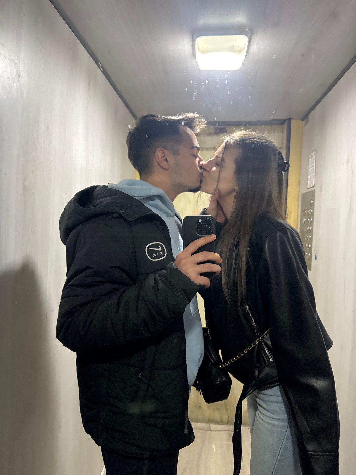 Couple shares intimate elevator moment while taking selfie in Sofia