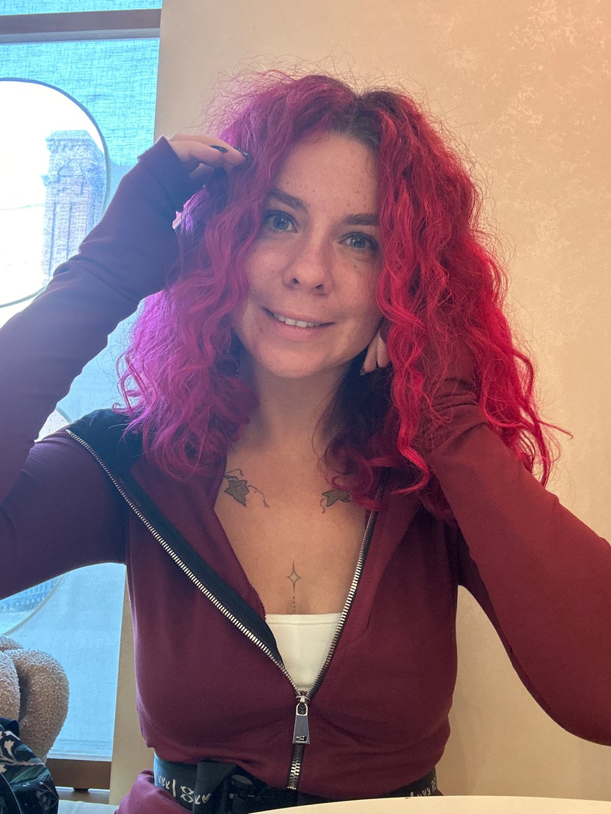 Red-haired woman photographed twice in Novosibirsk indoor locations