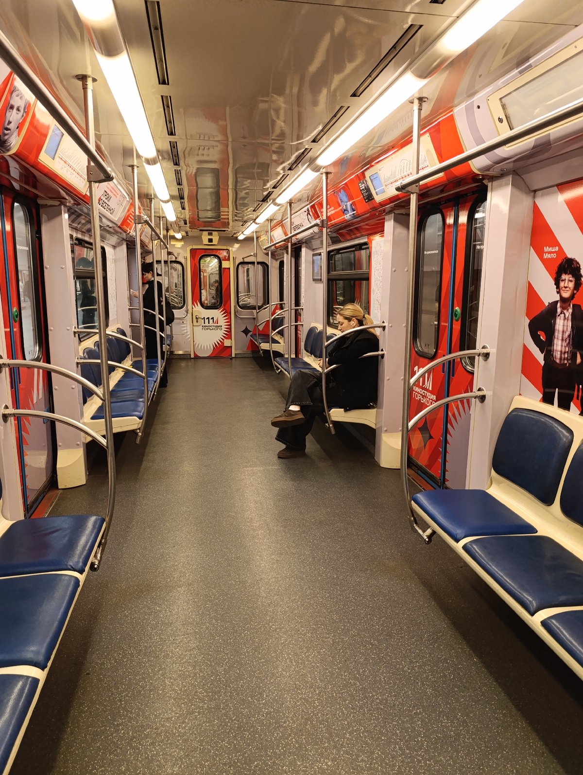 Father and son ride early morning subway in Russia