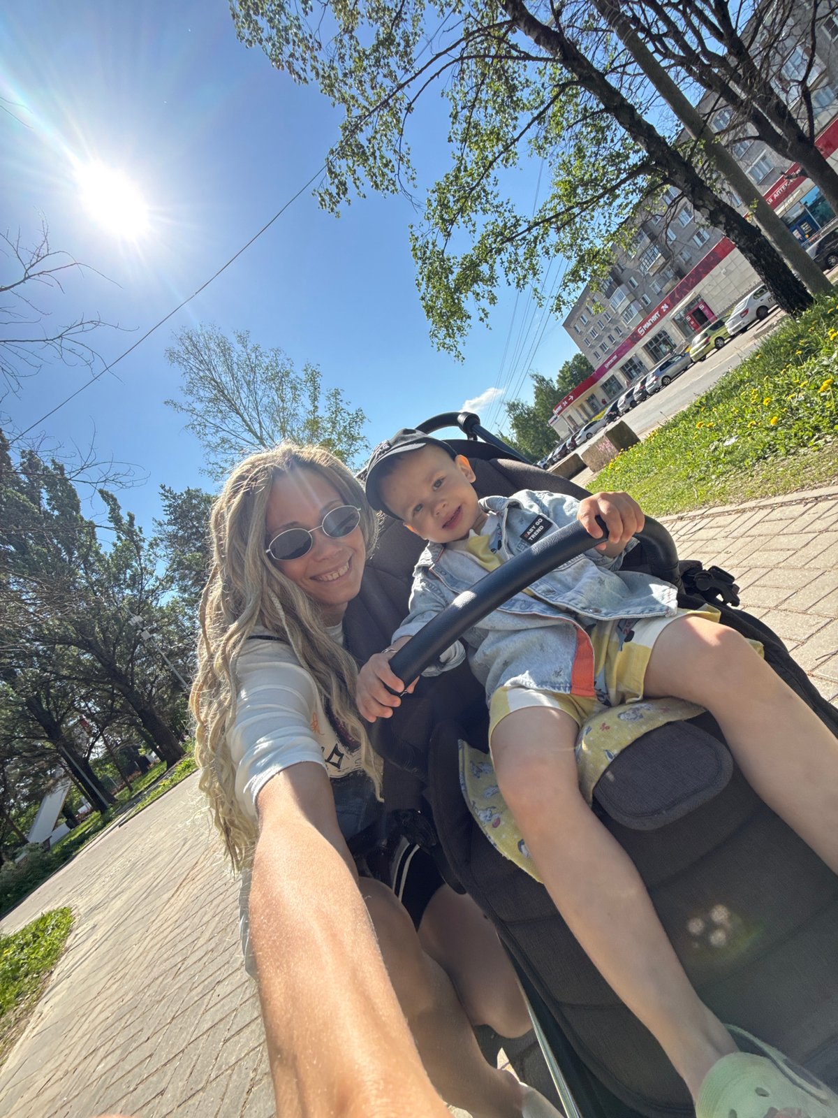 Morning park outing features mother, baby, and playground activity