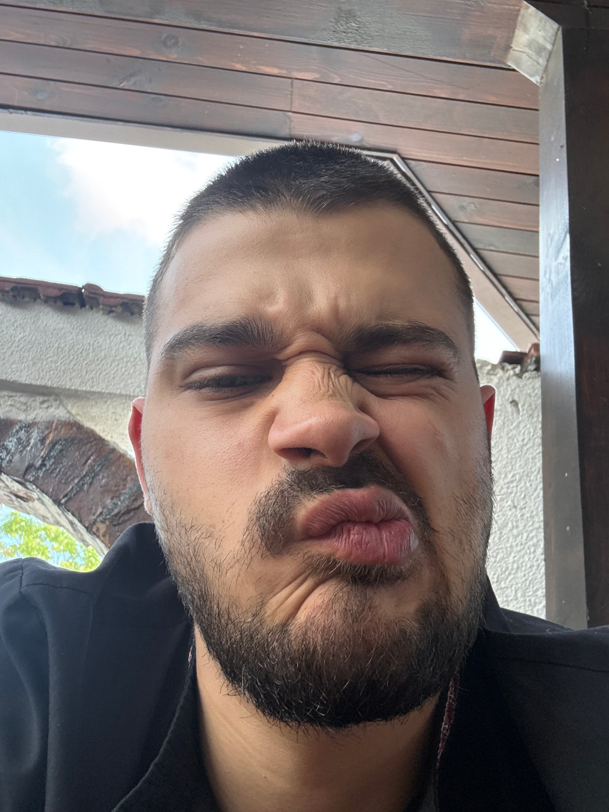 Man photographed making expressions, drinking coffee in Shumen